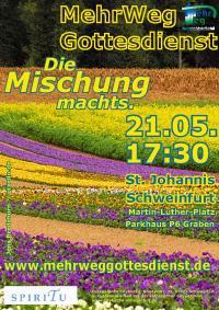 Plakat MehrWegGottesdienst: bunte Blumenwiese mit Wald im Hintergrund