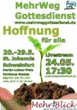 Keimling in etwas Erde auf einer Hand